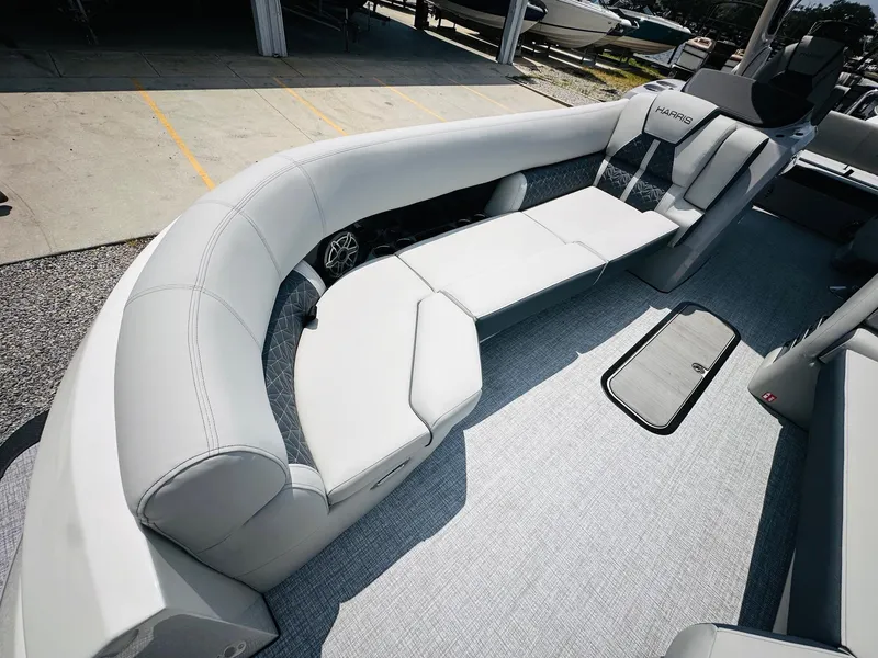 Slide: The Image of 2025 Harris Grand Mariner 250 boat with luxurious seating and modern design. - 14