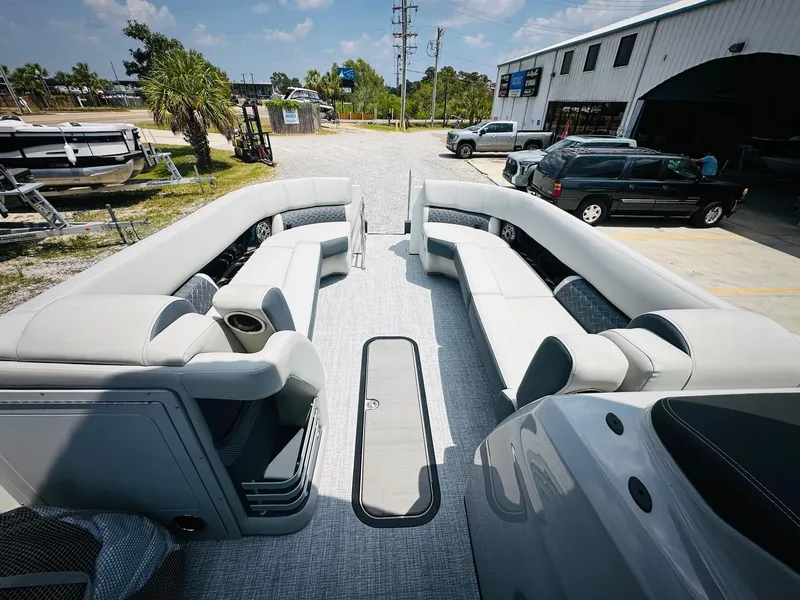 Slide: The Image of 2025 Harris Grand Mariner 250 pontoon boat interior with spacious seating and modern design. - 16