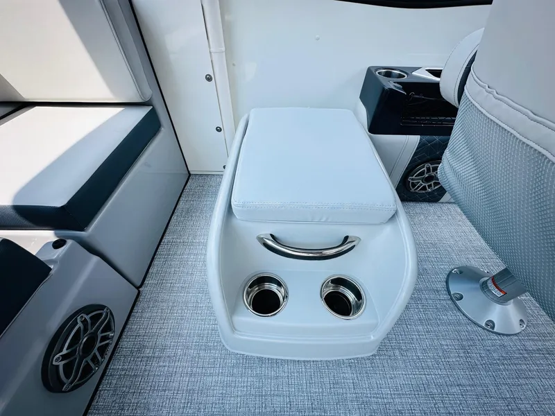 Slide: The Image of 2025 Harris Grand Mariner 250 interior with cup holders and cushioned seating. - 20