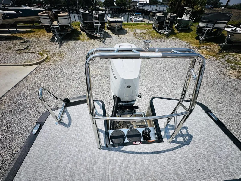 Slide: The Image of 2025 Harris Grand Mariner 250 pontoon boat with sleek design and powerful engine. - 22