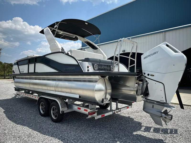Slide: The Image of 2025 Harris Grand Mariner 250 pontoon boat on trailer, featuring Mercury outboard engine. - 4