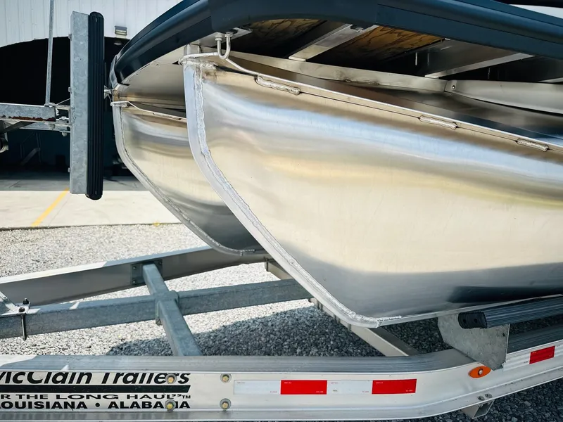 Slide: The Image of 2025 Harris Grand Mariner 250 pontoon boat on a McClain trailer. - 7