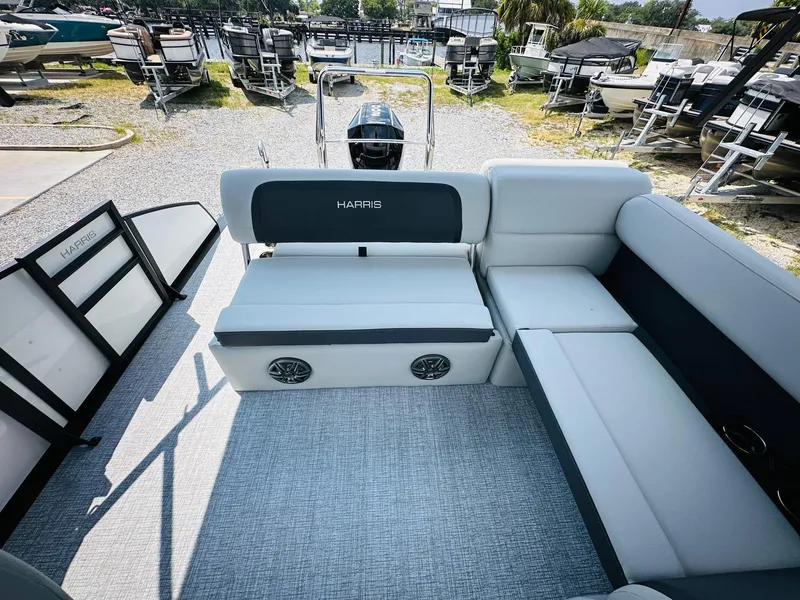 Slide: The Image of 2025 Harris Cruiser 230 pontoon boat interior with plush seating and modern design. - 15