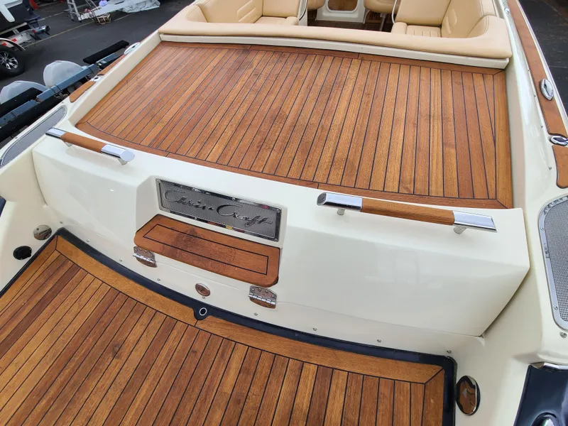 Slide: The Image of 2011 Chris-Craft Corsair 28 boat with elegant teak decking and luxurious seating. - 10