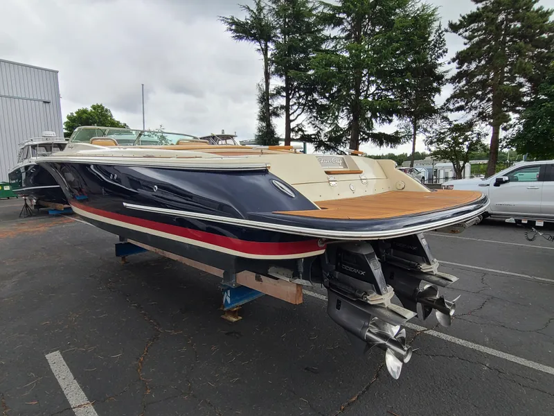 Slide: The Image of 2011 Chris-Craft Corsair 28 boat with dual engines, parked outdoors. - 3