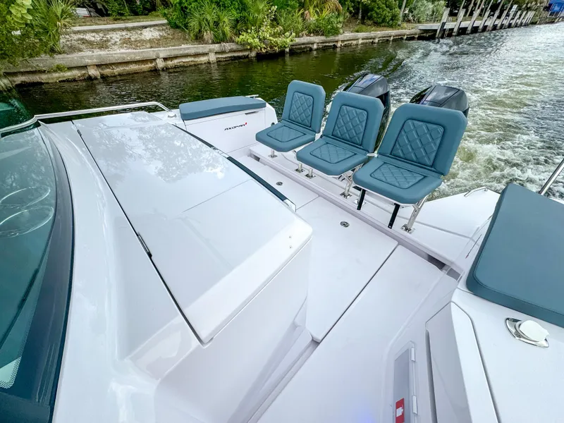 Slide: The Image of 2024 Axopar 37XC CROSS CABIN boat with sleek design and comfortable seating. - 18
