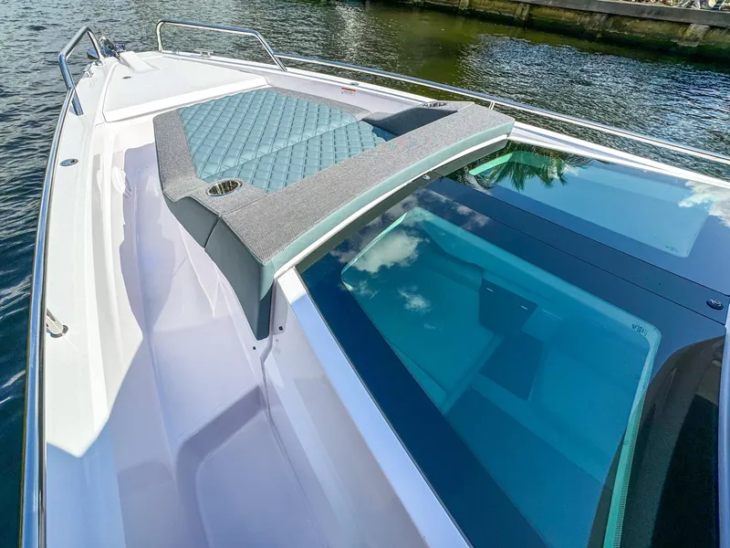Slide: The Image of 2024 Axopar 37XC CROSS CABIN boat with sleek design and sunbed on deck. - 21