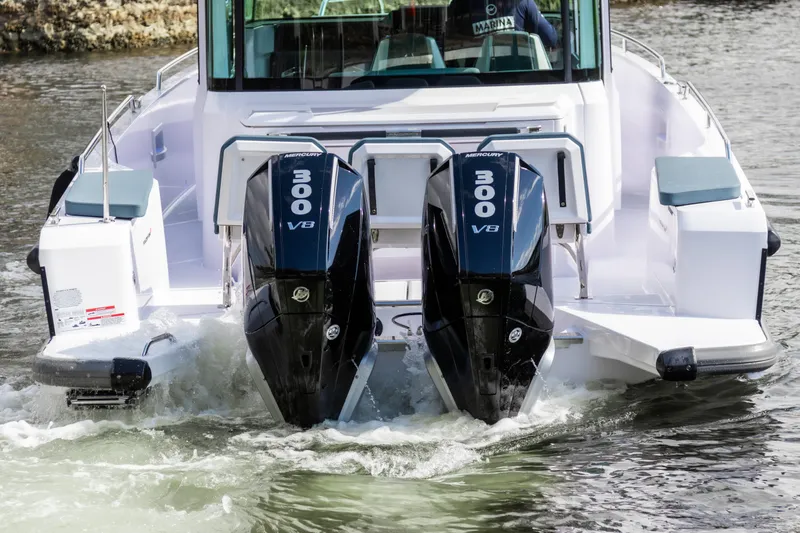 Slide: The Image of 2024 Axopar 37XC CROSS CABIN with dual 300 V8 engines on water. - 3