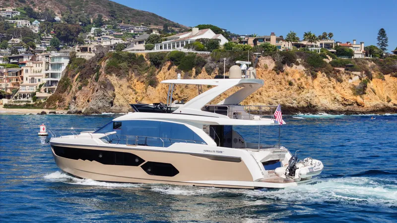 Slide: The Image of Luxury Absolute 58 FLY yacht cruising near scenic coastline, 2019 model. - 15