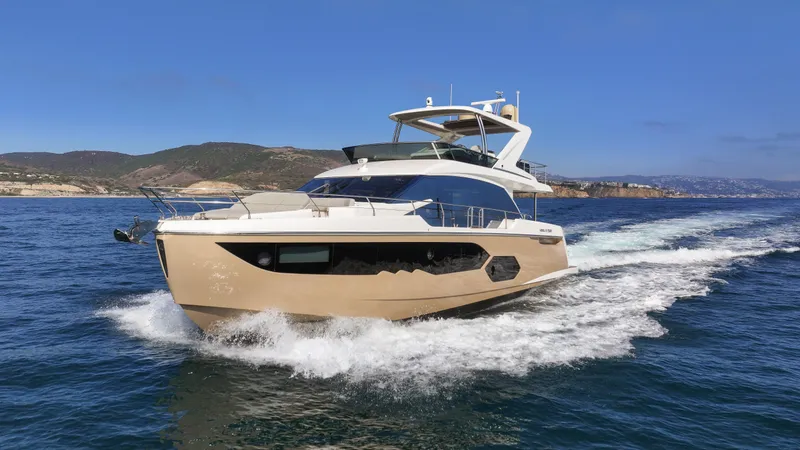 Slide: The Image of Luxurious 2019 Absolute 58 FLY yacht cruising on open water. - 17