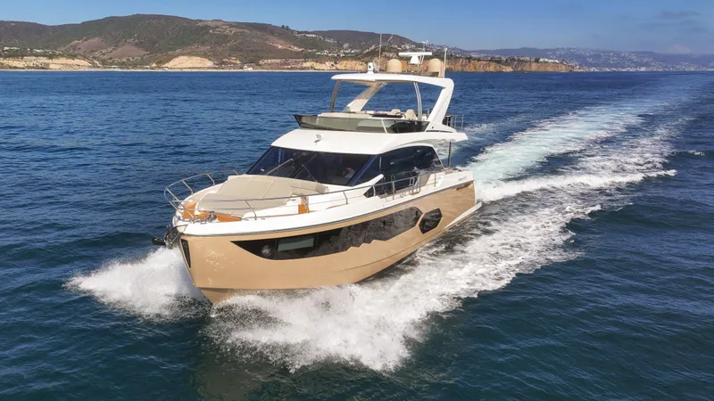 Slide: The Image of Luxury 2019 Absolute 58 FLY yacht cruising on open water. - 18