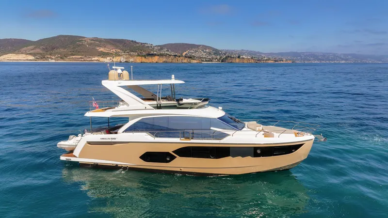 Slide: The Image of Luxurious 2019 Absolute 58 FLY yacht cruising on clear blue waters. - 2