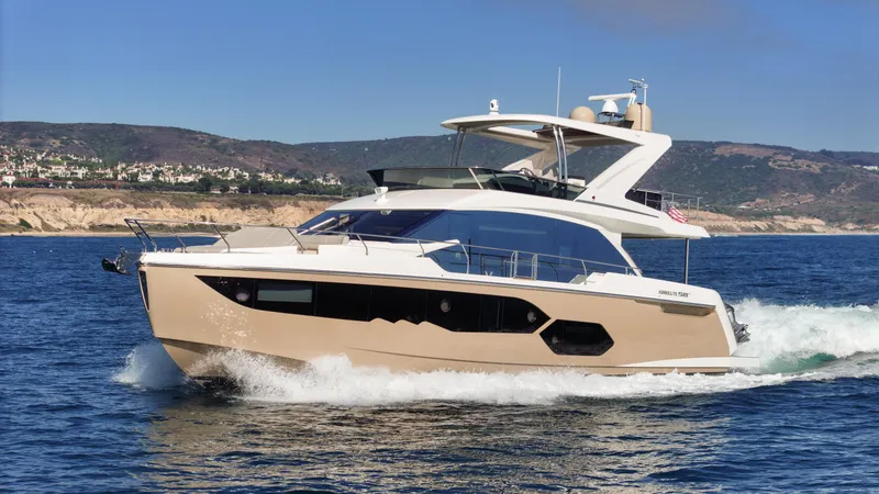 Slide: The Image of Luxurious 2019 Absolute 58 FLY yacht cruising on open water. - 20