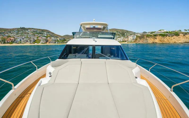 Slide: The Image of Luxury Absolute 58 FLY yacht cruising near scenic coastline, 2019 model. - 21