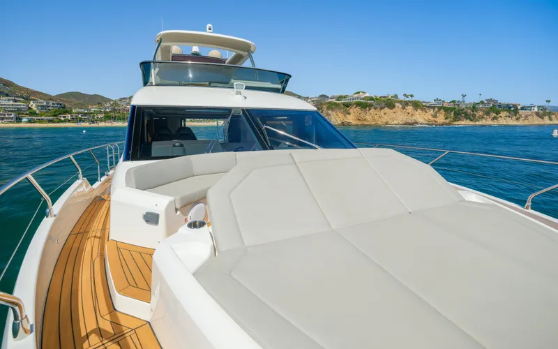 Slide: The Image of 2019 Absolute 58 FLY yacht cruising on clear blue waters. - 22