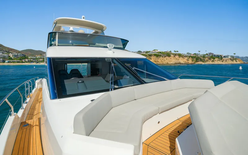 Slide: The Image of Luxury Absolute 58 FLY yacht cruising near scenic coastline, 2019 model. - 23