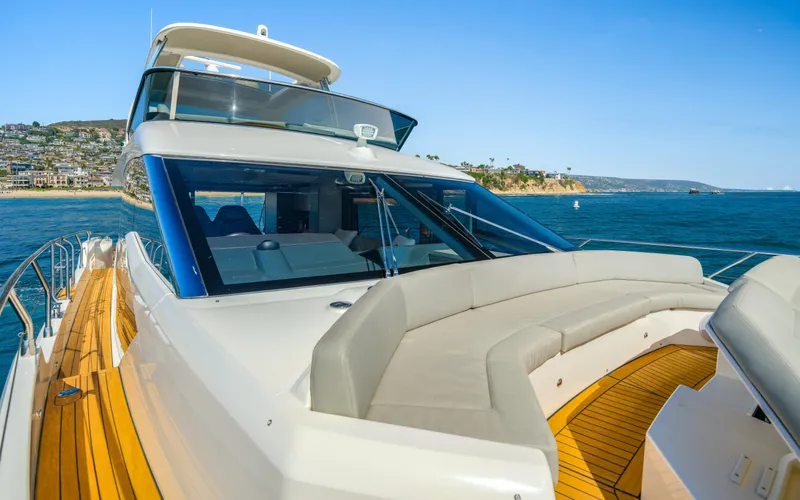 Slide: The Image of Luxury Absolute 58 FLY yacht, 2019 model, cruising near scenic coastline. - 25