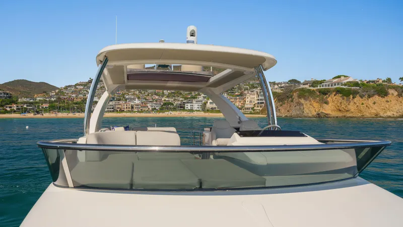 Slide: The Image of Luxury Absolute 58 FLY yacht, 2019 model, cruising near scenic coastline. - 27