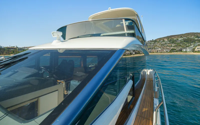 Slide: The Image of Luxury Absolute 58 FLY yacht cruising near scenic coastline, 2019 model. - 29