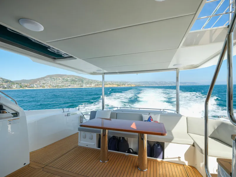 Slide: The Image of Luxurious 2019 Absolute 58 FLY yacht interior with ocean view and elegant seating area. - 31