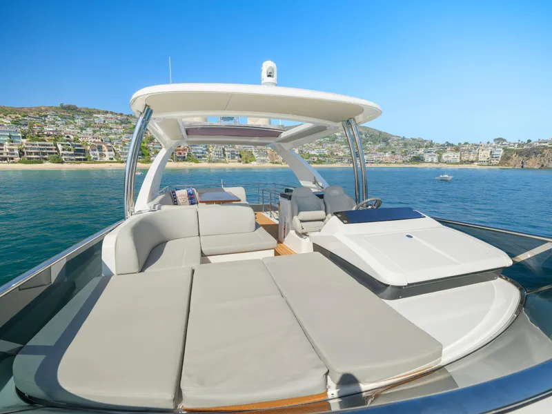 Slide: The Image of Luxurious 2019 Absolute 58 FLY yacht with spacious deck and scenic coastal view. - 36