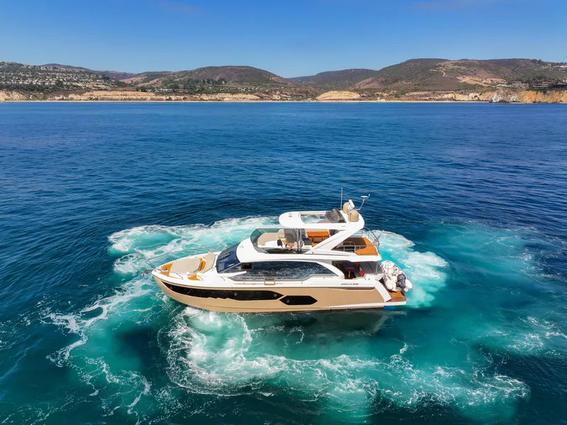 Slide: The Image of Luxury Absolute 58 FLY yacht cruising in clear blue waters, 2019 model. - 4