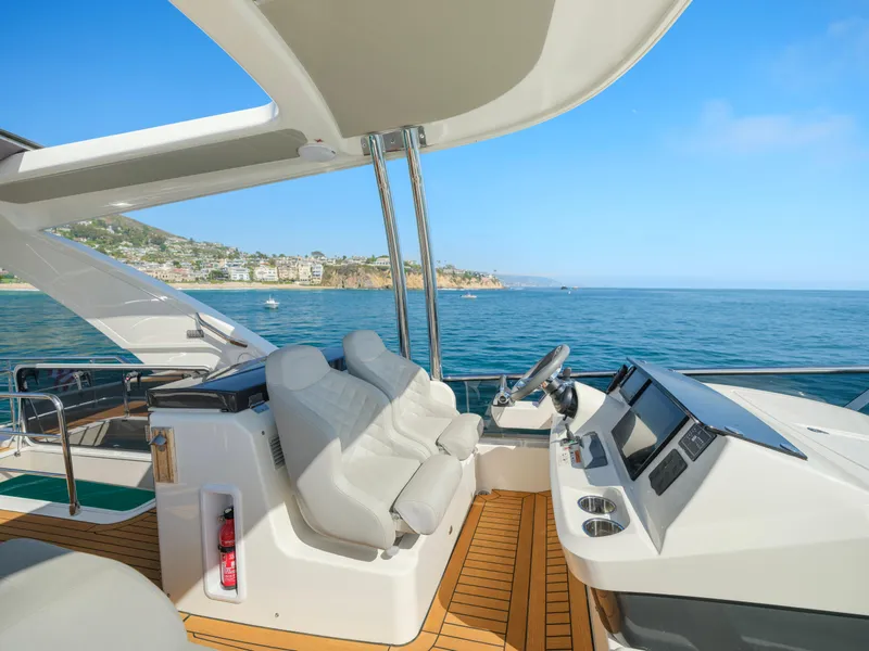 Slide: The Image of Luxury yacht Absolute 58 FLY 2019, featuring sleek helm and ocean view. - 40