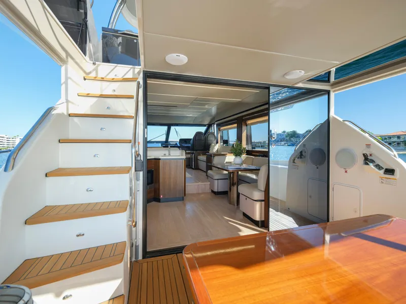 Slide: The Image of Luxurious interior of 2019 Absolute 58 FLY yacht with elegant wood finishes and spacious design. - 48