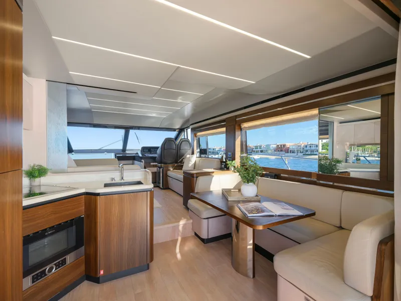 Slide: The Image of Luxurious interior of 2019 Absolute 58 FLY yacht with modern furnishings and large windows. - 49