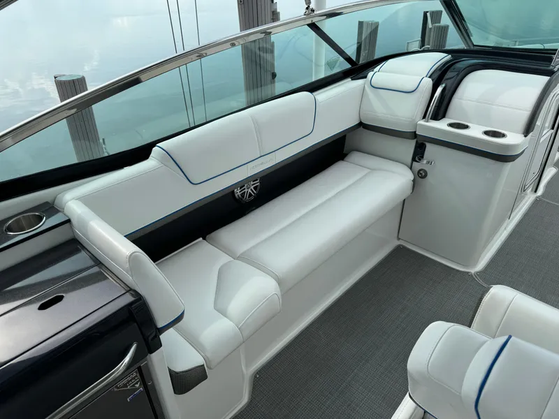 Slide: The Image of 2019 Formula 310 Bowrider OB interior with white seating and sleek design. - 37