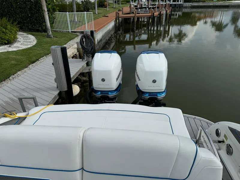 Slide: The Image of 2019 Formula 310 Bowrider OB docked with dual outboard engines. - 39