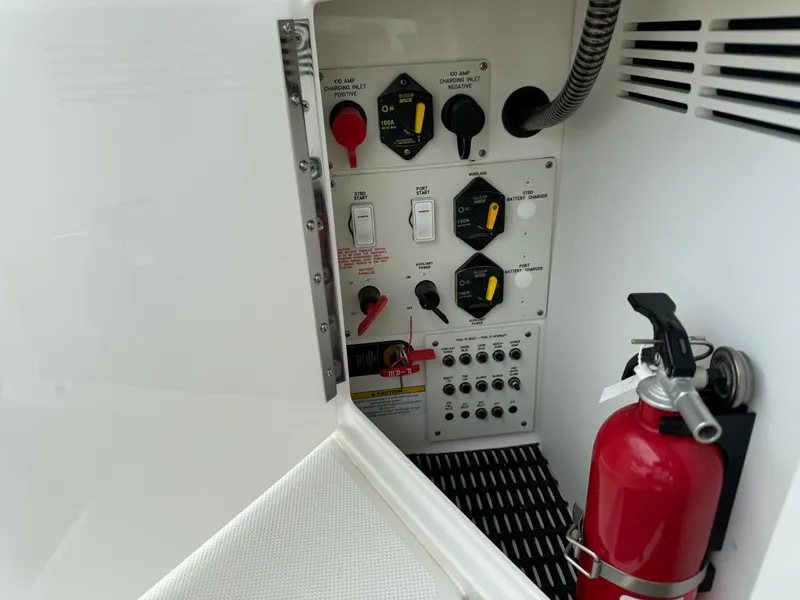 Slide: The Image of Control panel and fire extinguisher on 2019 Formula 310 Bowrider OB boat. - 41