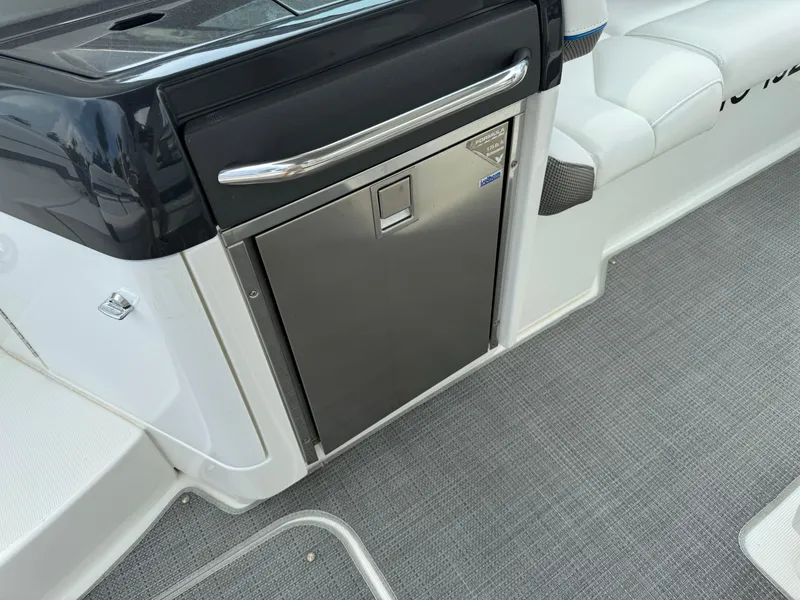 Slide: The Image of 2019 Formula 310 Bowrider OB interior with stainless steel mini fridge and seating. - 42