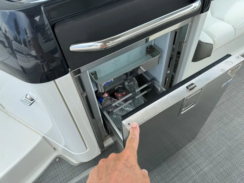 Slide: The Image of 2019 Formula 310 Bowrider OB boat with open mini fridge, stocked with drinks. - 43