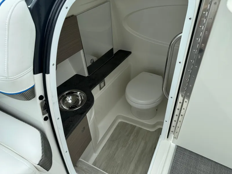 Slide: The Image of 2019 Formula 310 Bowrider OB boat interior with compact bathroom amenities. - 44