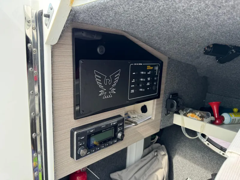 Slide: The Image of Control panel inside 2019 Formula 310 Bowrider OB boat cabin, featuring electronic equipment. - 45