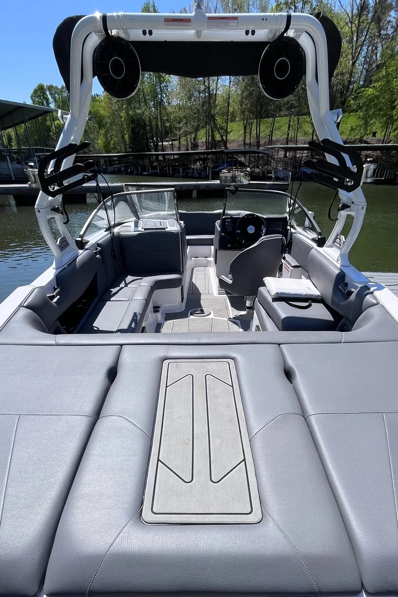 Slide: The Image of 2024 Moomba Max boat interior with sleek seating and advanced audio system. - 10