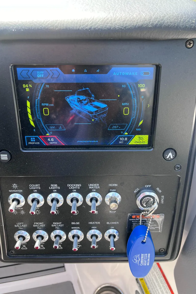 Slide: The Image of 2024 Moomba Max dashboard with touchscreen display and control switches. - 19