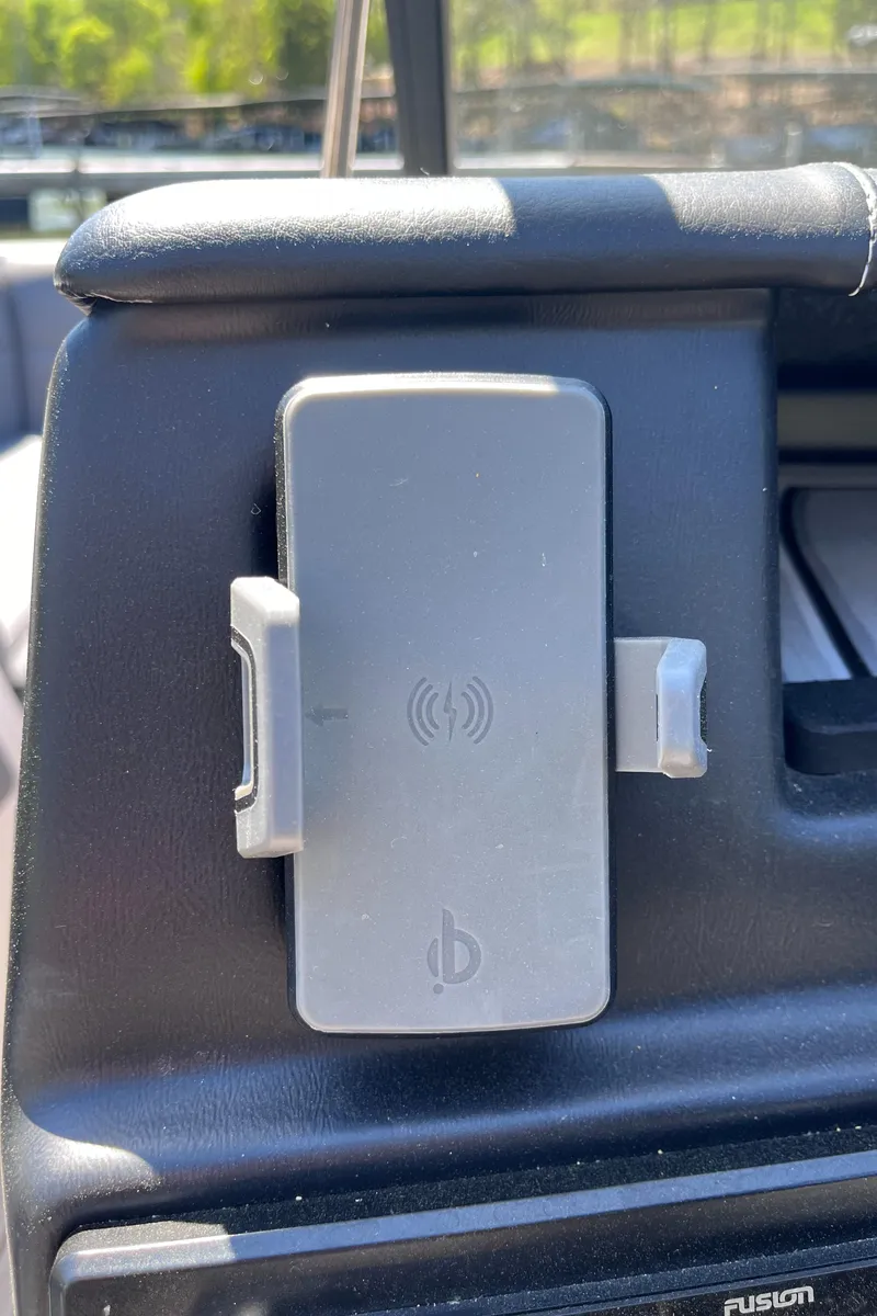 Slide: The Image of 2024 Moomba Max phone holder with wireless charging feature in vehicle interior. - 20