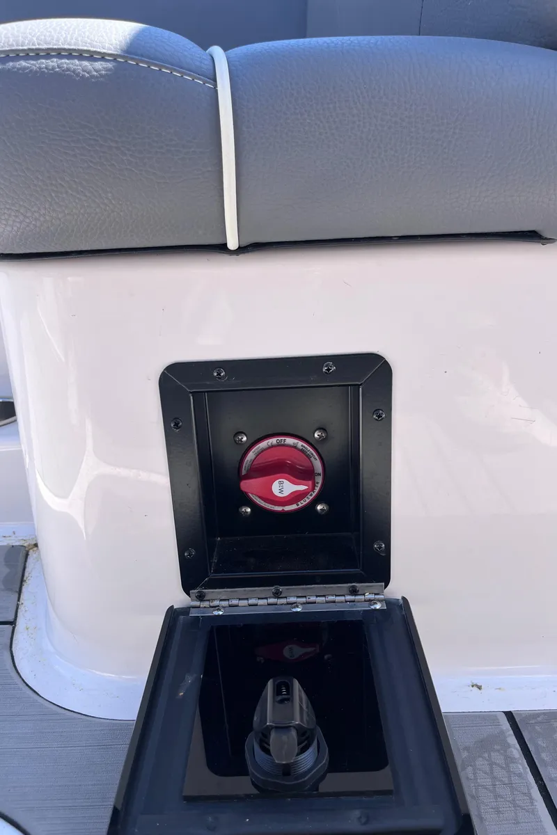 Slide: The Image of 2024 Moomba Max boat battery switch with protective cover. - 25