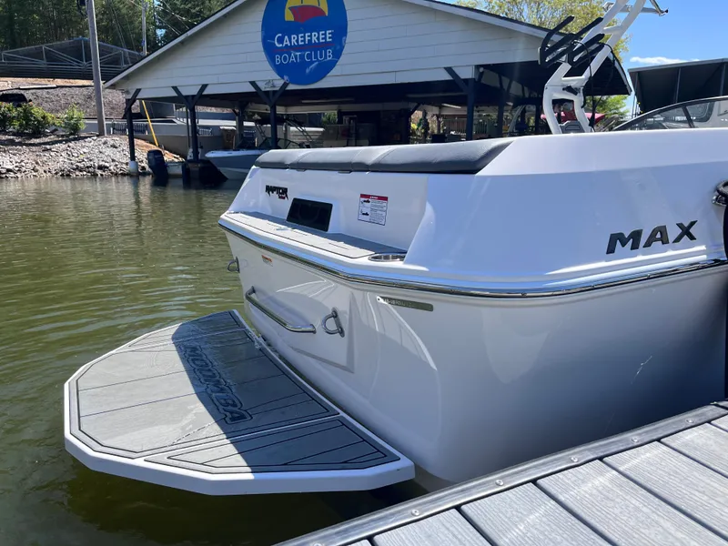 Slide: The Image of 2024 Moomba Max boat at dock near Carefree Boat Club. - 3
