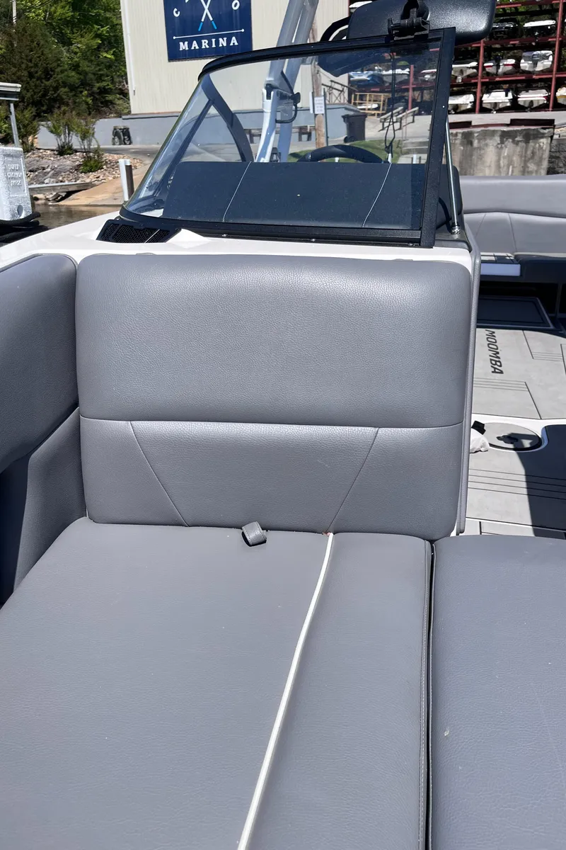 Slide: The Image of 2024 Moomba Max boat interior with gray seating and windshield. - 30