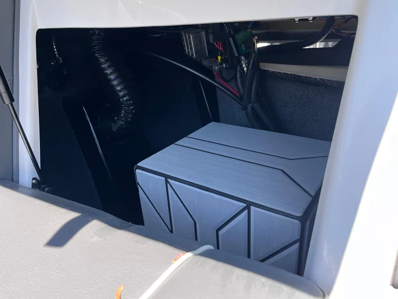 Slide: The Image of 2024 Moomba Max storage compartment with modern design and wiring details. - 32