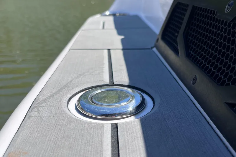 Slide: The Image of 2024 Moomba Max boat detail with sleek deck and chrome fixture. - 7