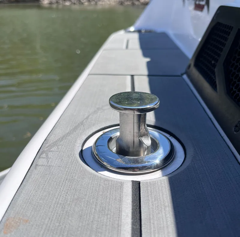 Slide: The Image of 2024 Moomba Max boat cleat on deck by the water. - 8