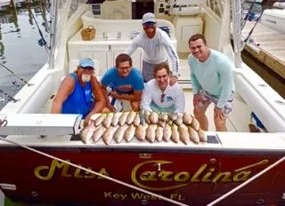 Slide: The Image of Group on 2001 Carolina Classic 35 boat with fish catch, Key West, FL. - 12