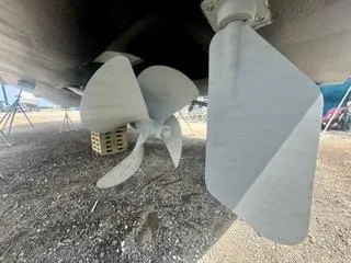 Slide: The Image of Propeller and rudder of 2001 Carolina Classic 35 boat on dry dock. - 17