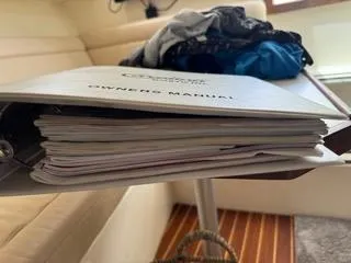 Slide: The Image of Owner's manual for 2001 Carolina Classic 35 on a table. - 18