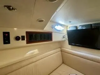 Slide: The Image of Interior of 2001 Carolina Classic 35 boat with seating and mounted TV. - 19