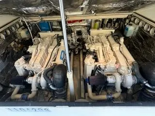 Slide: The Image of Engine room of a 2001 Carolina Classic 35 boat, featuring dual engines. - 25